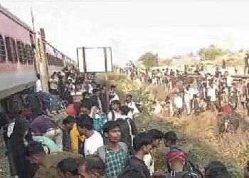 Fire alert sparks panic; 12 die jumping onto tracks.